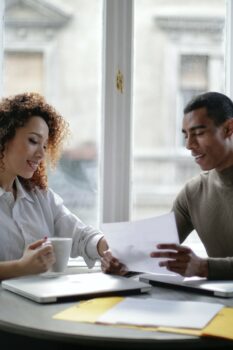 Couple working at table (Photo courtesy of Pexels.com)