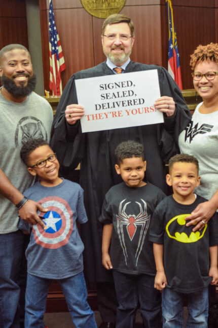 Brandon and Everlean Rutherford and their biological son and foster sons