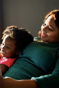 Mom with her daughter on laptop