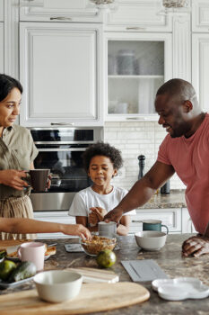 family in the kitchen making dinner