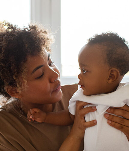 mom holding baby